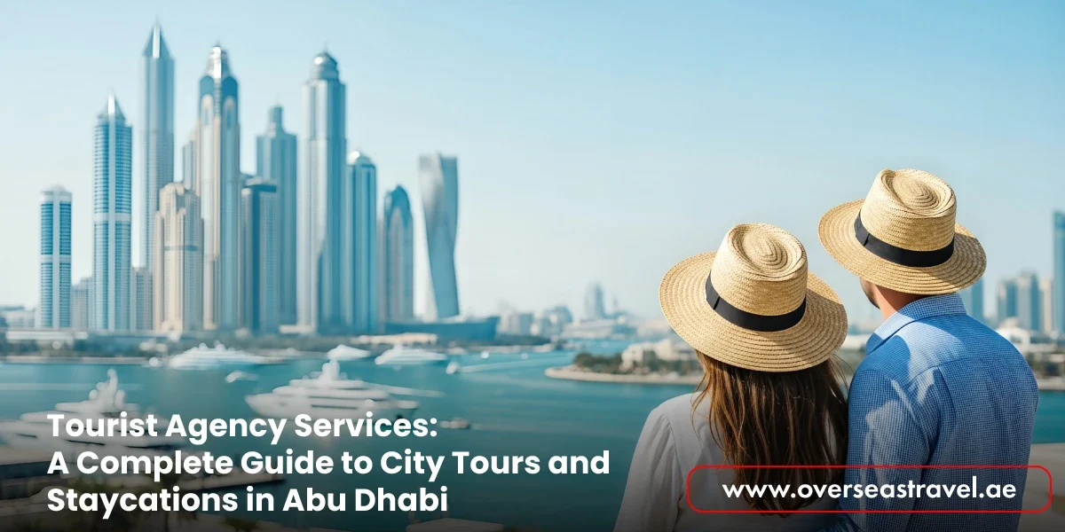 A couple wearing straw hats looks out over the Dubai Marina skyline and waterfront, promoting Tourist Agency Services for city tours and staycations in Abu Dhabi via the Overseas Travel website.