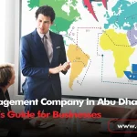 A professional presenter in a suit stands before a world map graphic illustrating global logistics and transport icons, discussing corporate travel solutions with a team in a boardroom.