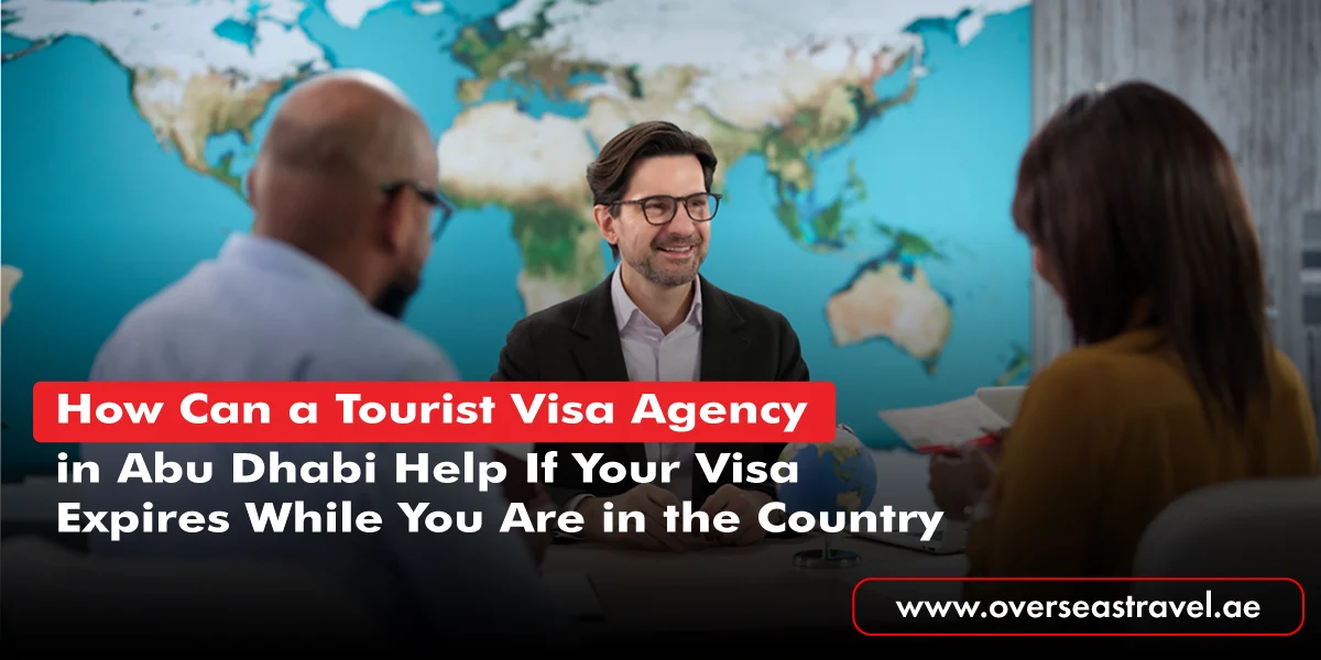 One professional from a Tourist Visa Agency in Abu Dhabi discussing visa requirements with two travelers.