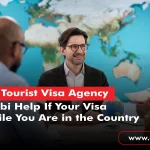One professional from a Tourist Visa Agency in Abu Dhabi discussing visa requirements with two travelers.