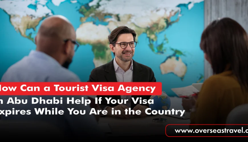 One professional from a Tourist Visa Agency in Abu Dhabi discussing visa requirements with two travelers.